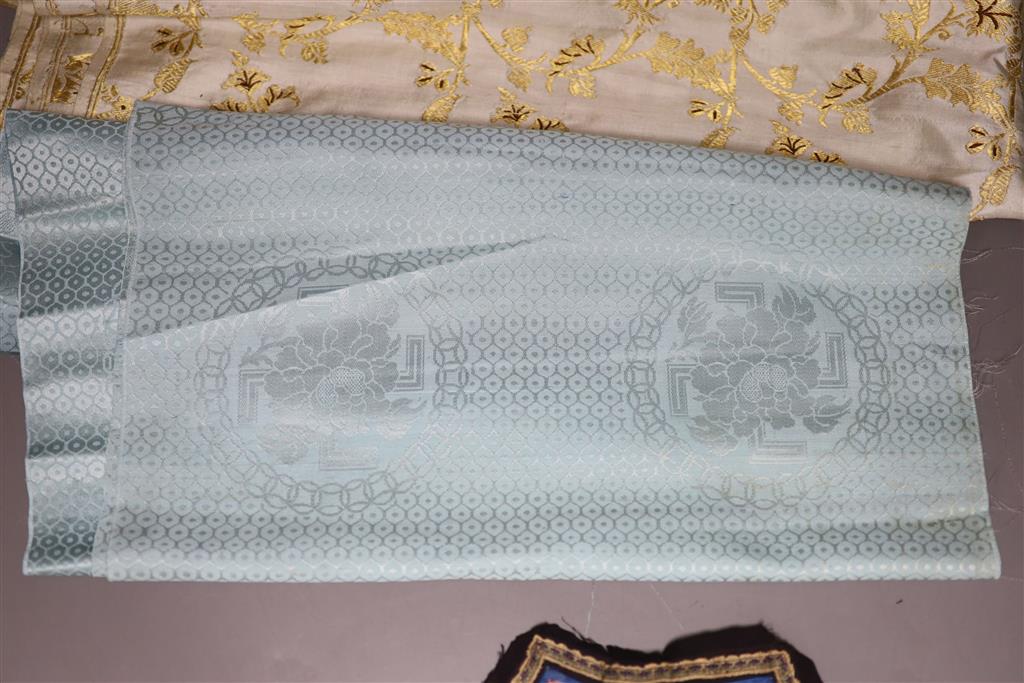 A Chinese gauze work bolt, Qing dynasty, an Indian silk sari, a Chinese bolt of brocade and a collar